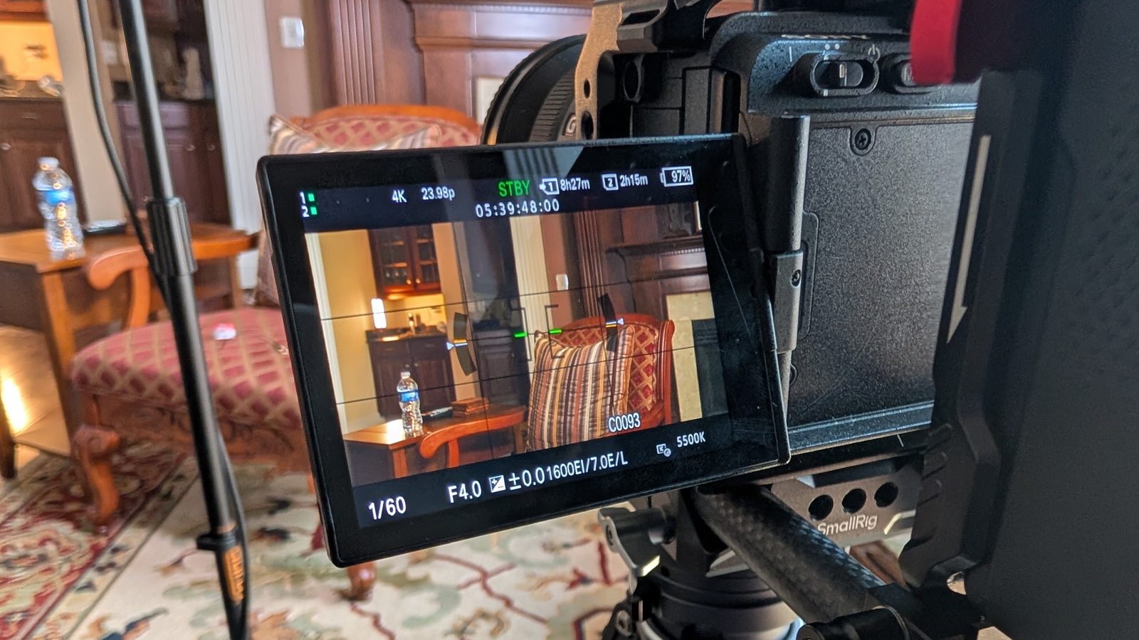 Close view of the camera monitor showing the framed empty interview chair